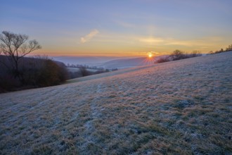 A frosty morning with sunrise over a rolling landscape, Seckmauern, Lützelbach, Maintal, Odenwald,