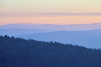 Shady hills and a calm pastel sky at sunset create a quiet atmosphere, Seckmauern, Lützelbach,