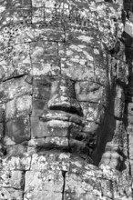 Huge stone-carved face of Bodhisattva Lokeshvara, also Avalokiteshvara, Bayon Temple, Angkor Thom,