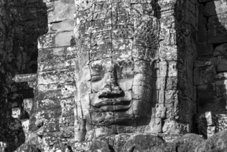 Huge stone-carved face of Bodhisattva Lokeshvara, also Avalokiteshvara, Bayon Temple, Angkor Thom,