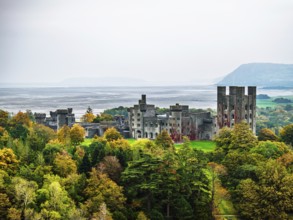 Autumn colours over Penrhyn Castle and Garden from a drone, Llandygai, Bangor, Gwynedd, North