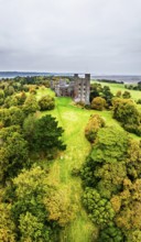 Autumn colours over Penrhyn Castle and Garden from a drone, Llandygai, Bangor, Gwynedd, North
