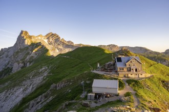 Mountain hut on the Rotstein Pass with a view of the Lisengrat and the summit of the Säntis,
