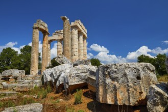 Ancient ruins and pillars under a cloudy blue sky, Nemea, Ancient Zeus Heightum, Archaeological