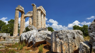 Ancient columns and ruins under a clear blue sky, Nemea, Ancient Zeus Heightum, Archaeological