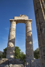 Single antique column with clear sky in the background. Greek Ruins, Nemea, Ancient Zeus Heightum,