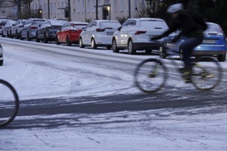 Winter, slippery roads with snow and ice, slippery roads, cyclists, Germany