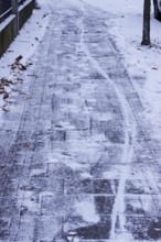 Winter, slippery roads with snow and ice, footpath, slippery roads, Germany