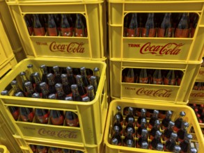 Bottles stacked in boxes drink soft drink without sugar Coca-Cola Coke Coca Cola Zero Sugar,