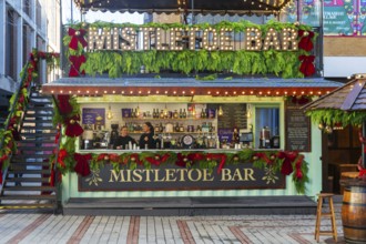 Mistletoe Bar Christmas market wooden shed market stall in city centre, Exeter, Devon, England, UK