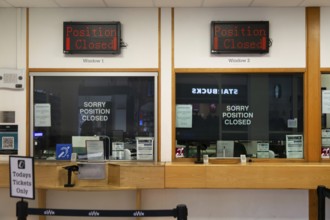 Position Closed signs at railway ticket office, Exeter St Davids railway station, Exeter, Devon,