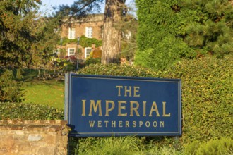 Sign in garden of The Imperial Wetherspoon pub, Exeter, Devon, England, UK