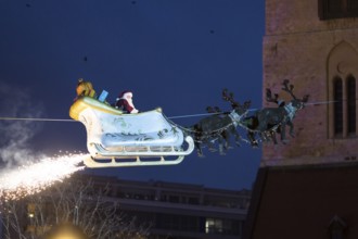 Santa Claus floats in a carriage at the opening of the Berlin Christmas market on Alexanderplatz,