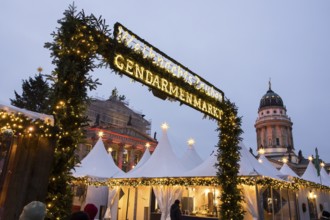 Entrance and stalls at the Christmas market WeihnachtsZauber Gendarmenmarkt on the Gendarmenmarkt,