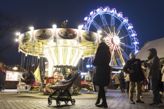 Children's carousel and Ferris wheel at the Berlin Christmas market on Alexanderplatz, Berlin, 24