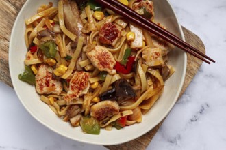 Fried noodles with chicken meat and vegetables, Bami Goreng, Indonesian dish, no people