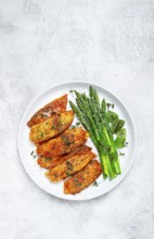 Fried fish fillet, tilapia with asparagus, homemade, no people