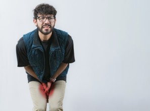 Young woman with hemorrhoids problems. Person with medical problem urinary. Male with hands on