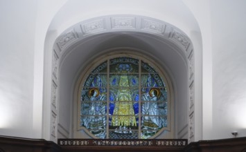 Interior photo, stained glass window, tympanum window above the main entrance, main evangelical
