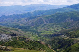 Scenic view of mountains and valleys, green hills, blue sky in the background, view from Vardenyats
