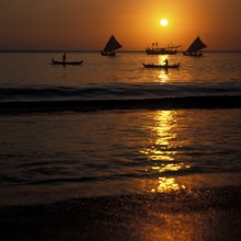 Fishing boats in Jimbaran Bay at sunset, Bali, Indonesia