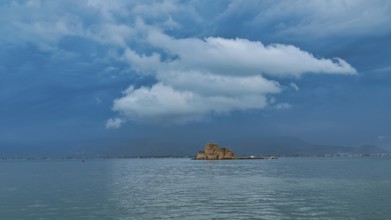Bourtzi island fortress, a castle located on a small island surrounded by calm waters under a