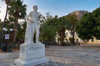 Old town of Nauplion, statue of Ioannis Kapodistrias, A statue stands in a square lined with palm