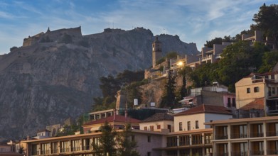 Palamidi fortress, town with a castle on a hill in the morning light, surrounded by old buildings
