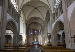 Large church interior view with arches, glass windows and altar in a quiet atmosphere, Boniface