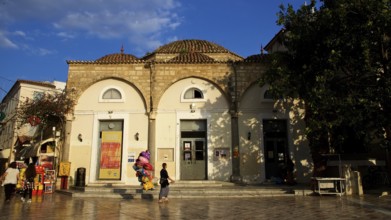 Old town of Nauplion, old building with round arch and blue sky in the background, Nauplion,