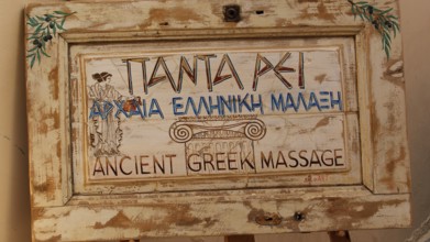 Old Town of Nauplion, An antique wooden sign with Greek writing and decorative motifs, Nauplion,