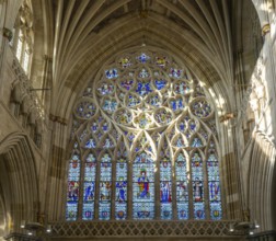 Stained glass of the west window inside Exeter cathedral church, Exeter, Devon, England, UK