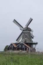De Rat windmill on the river Geeuw, wood sawmill, Ijlst, Friesland Province, Netherlands