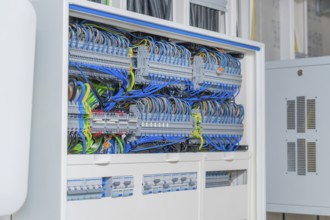 Cable management system with lots of colorful cables in a control box