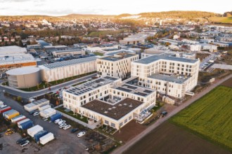 Aerial view of a city panorama with modern buildings and adjacent fields, new hospital, Calw health