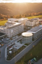 Modern buildings in autumn light with surrounding nature and gentle sunset, new hospital, Calw