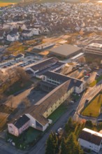 Rural aerial view with school buildings and roads in an autumnal atmosphere, Althengstett, Calw