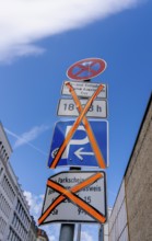 Traffic signs invalidated by masking over a side street in Berlin, Germany
