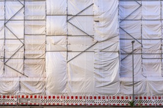 White construction plans cover the entire construction site of a building, Ziegelstraße, Berlin,