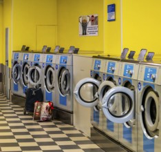Washing machines in a public laundromat, Frankfurt am Main, Hesse, Germany