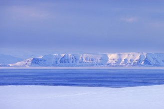 Snow covered mountains in Arctic landscape at Mohnbukta, bay at the western shore of Storfjorden in