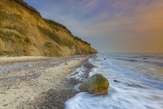 Sea cliffs and crumbling shoreline at sunset near Wustrow on the Fischland peninsula along the