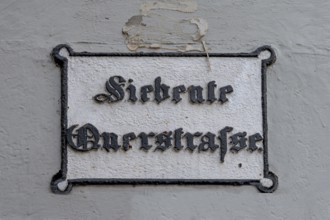 Seventh Cross Road, a historic street sign in the old town, Hanseatic City of Lübeck,