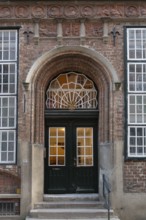 Entrance of a historic residential building with terracotta decoration, built around 1560,
