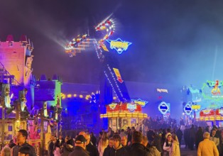 Many people at the All Saints Fair at night, the biggest old town fair in Europe, Soest, North