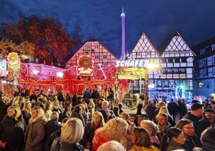 Many people at the All Saints Fair in the evening in front of half-timbered houses, Old Town,