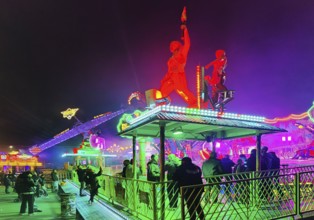 Colourfully illuminated All Saints Fair at night, the largest old town fair in Europe, Soest, North