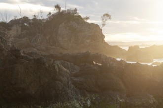 Sunset at Fisherman's Lookout. Dramatic waves and coastal scenery at The Pass, New South Wales,