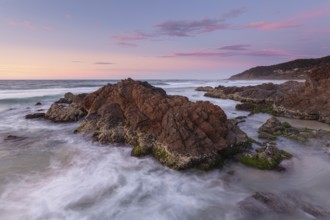 Spectacular sunset over the Pacific Ocean at The Pass with views of Wategos Beach, Byron Bay,