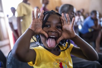 Young girl making grimaces, locals, Caprivi strips, Namibia